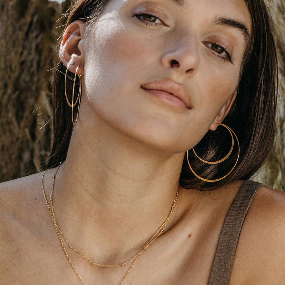 
                      
                        woman wearing 2" classic hoop earrings
                      
                    