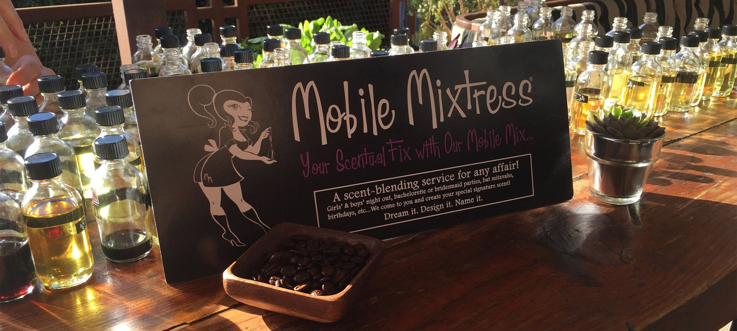 mobile mixtress sign with bottle of fragrance oils