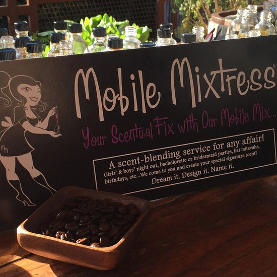 mobile mixtress sign with bottle of fragrance oils